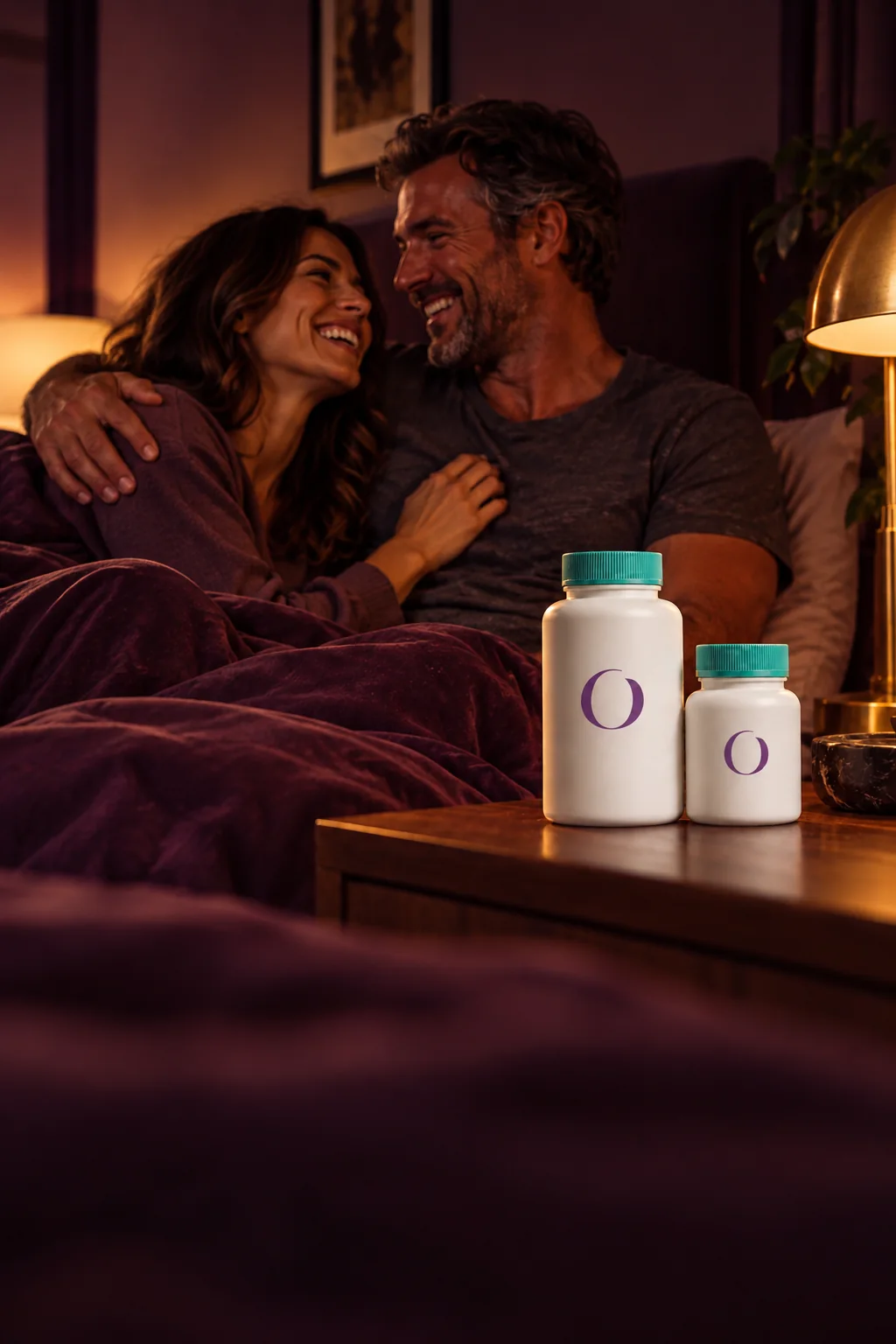 Couple laughing together in a warm bedroom, two OnTrend bottles on the nightstand